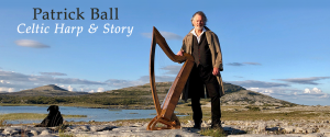Patrick Ball with a harp outside in Ireland.